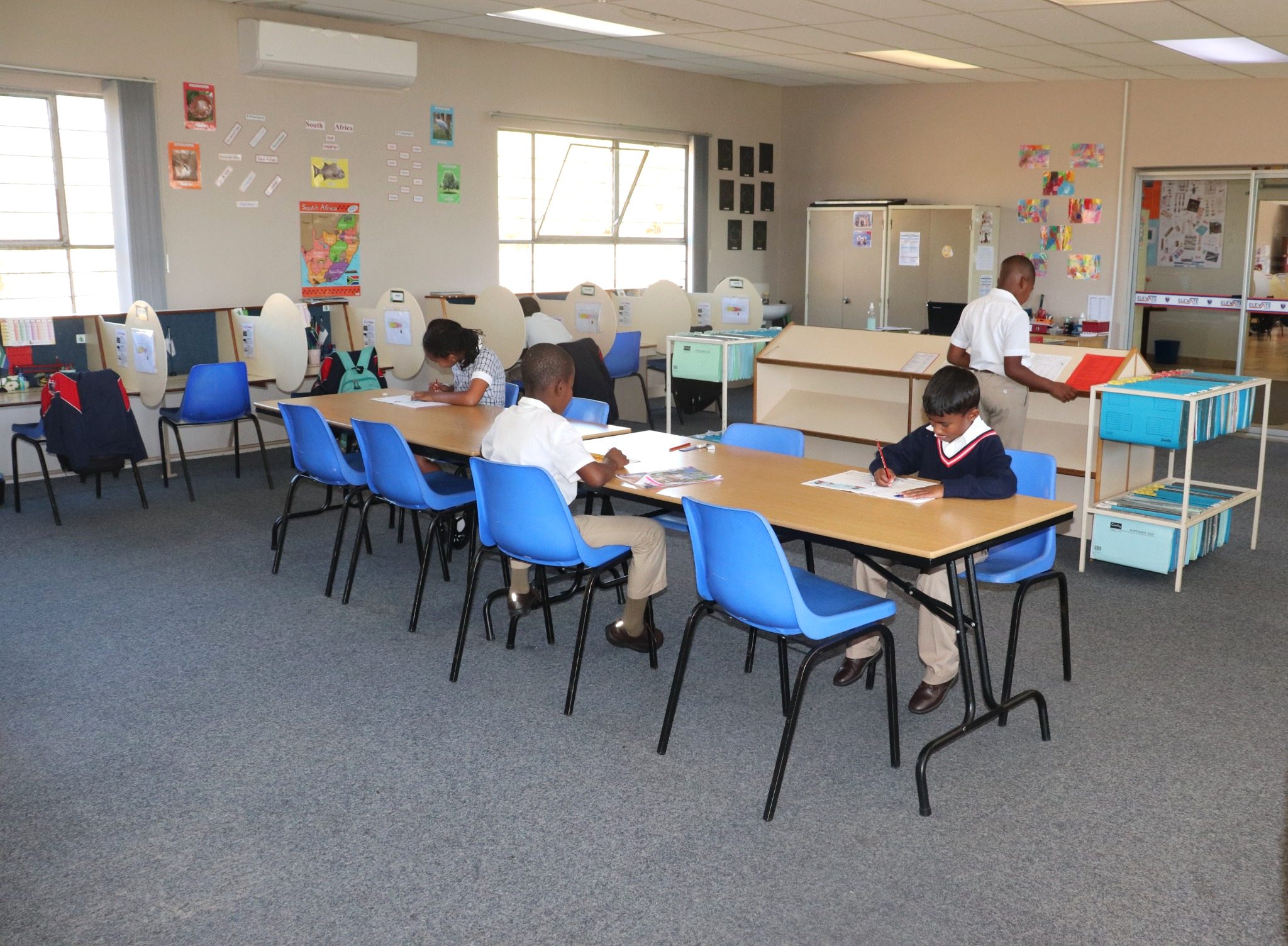 Grade 2 learners working independently in an ECA classroom